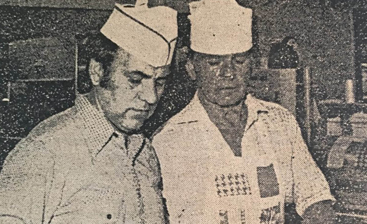 Brothers Thomas (left) and Melvin Bessinger work at grill (Charleston Evening Post, June 30, 1976)